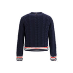 Back view of Thom Browne Cable knit Sweater with tricolor hem and cuffs, showcasing elegant wool cable-knit design.