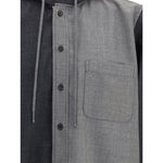 Close-up of Thom Browne Hooded Shirt Jacket with drawstring hood, button closure, chest patch pocket, and iconic signature patch, AW25 season.
