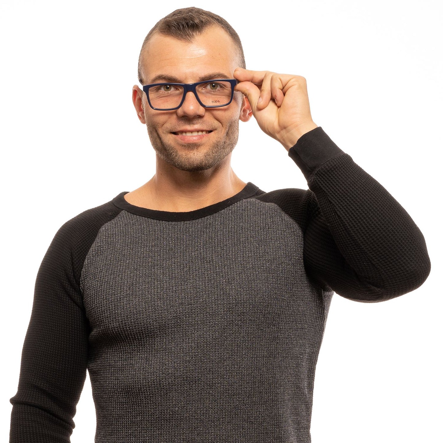 Man wearing Tod's Chic Blue Rectangular Men's Eyewear, showcasing stylish and sophisticated blue frames for discerning gentlemen.