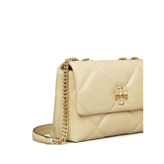 Tory Burch Kira Diamond small leather shoulder bag in light yellow nappa leather with quilted foldover, chain strap, and gold-tone logo.