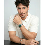 Man wearing VICEROY Mod. 401447-65 watch with green dial and quartz movement, showcasing elegant design and bracelet style.