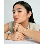 Woman wearing VICEROY Mod. 41148-77 chronograph bracelet watch with a stylish chain bracelet.