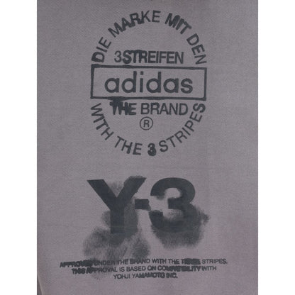 Y-3 Gray Cotton Sweatshirt with bold graphic logo and text on soft cotton fabric, showcasing urban style and avant-garde design.